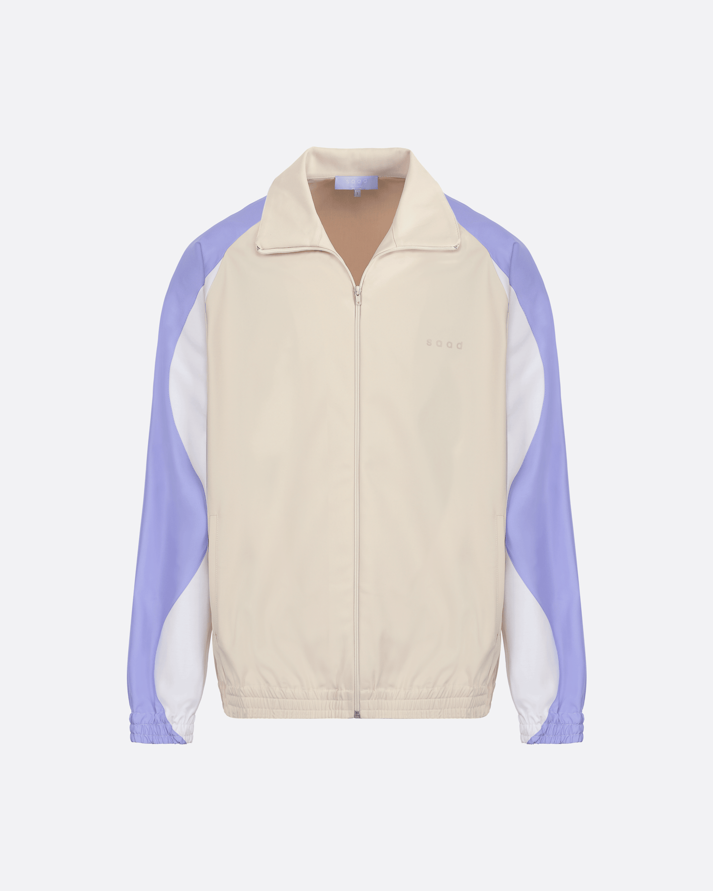 Veste zippée beige avec empiècements blanc et bleu sur les manches logo saad ton sur ton côté coeur